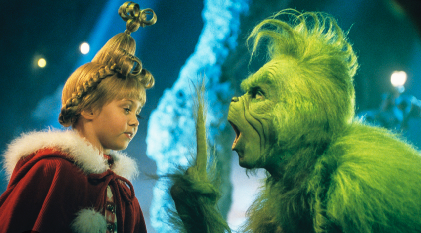 a picture of the Grinch, that green hairy monster, trying to take Christmas from a child but they changed didn't they