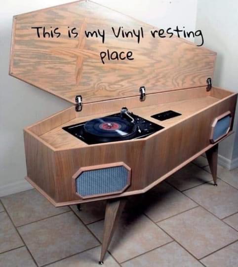 a record player is built into a coffin, and the title reads 'This is my vinyl resting place.